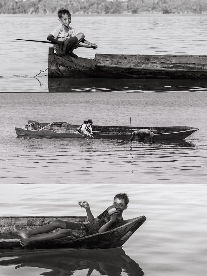 A fisherman in a wooden canoe