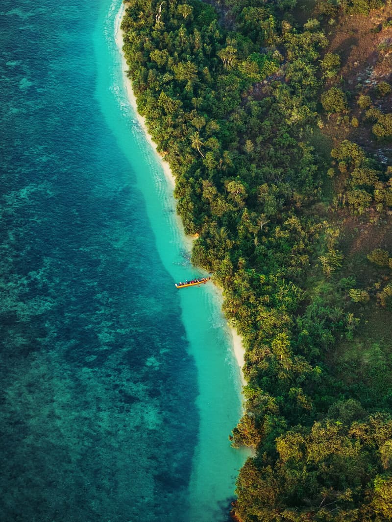A long sandbar in open turquoise sea